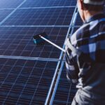 cleaning solar panels on a pitched roof