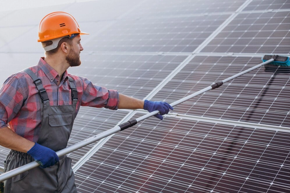 cleaning solar panels on a pitched roof